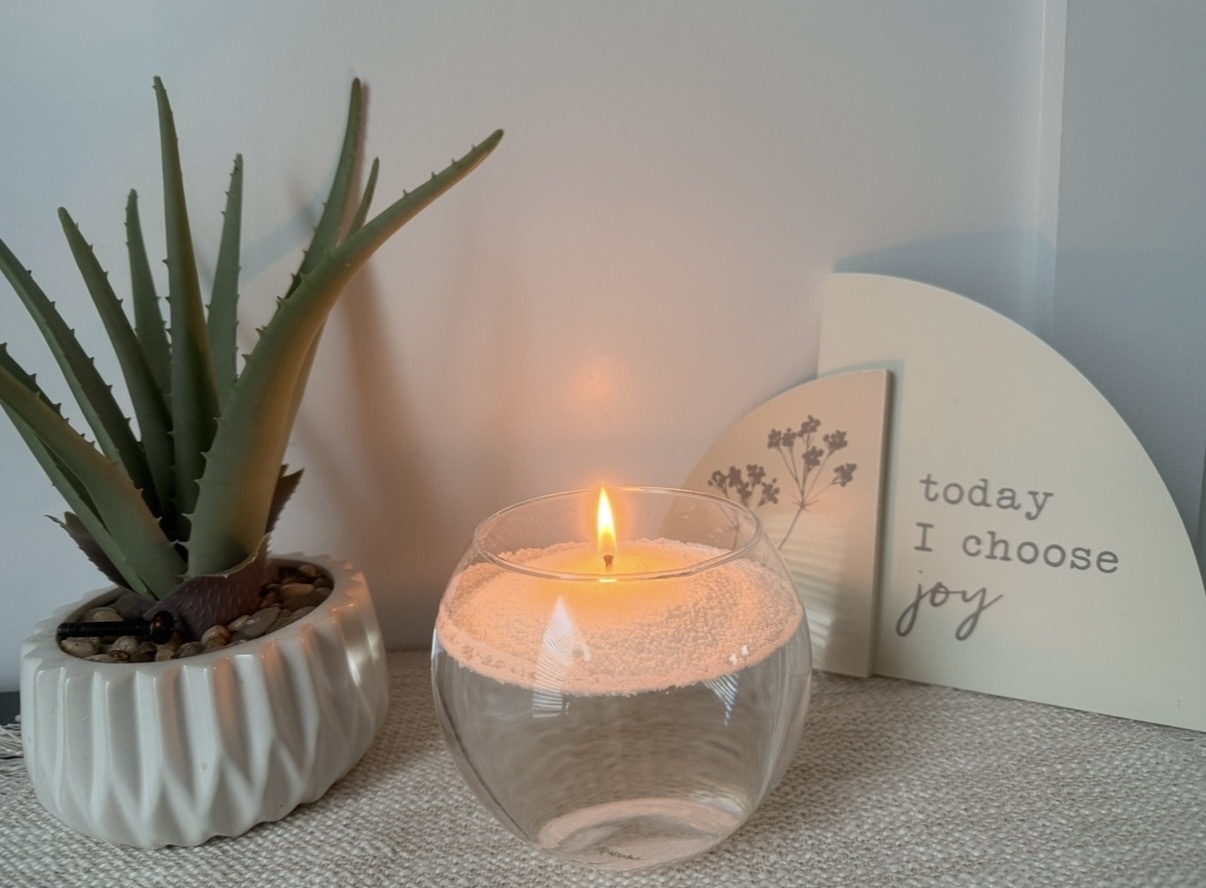Douce Âme candle floating on water